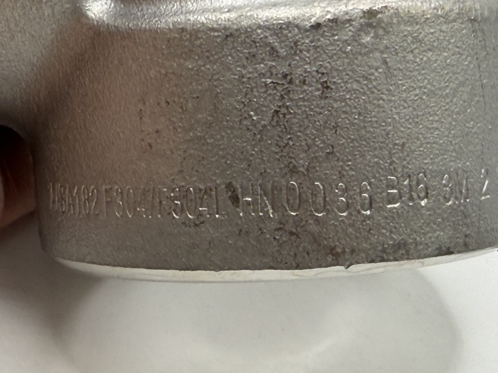 Heat number stamped on metal product
